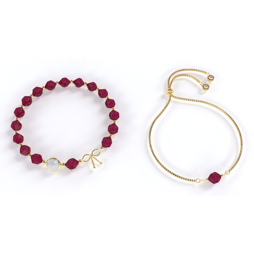 Bracelet avec des pierres de corindon qui alternent avec de petites billes en or, avec une seule pierre de quartz rutile en son centre, entourée d'un anneau en or. Le bracelet est composé de corindon rouge et d'or fin.